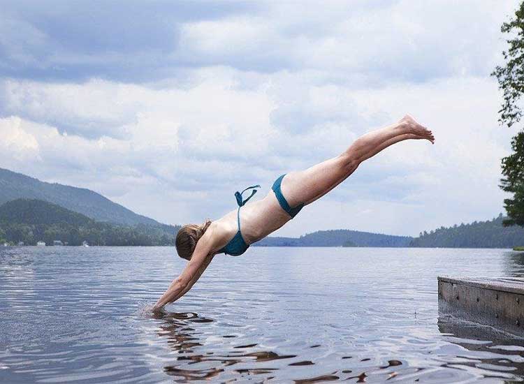 Woman diving on the lake
